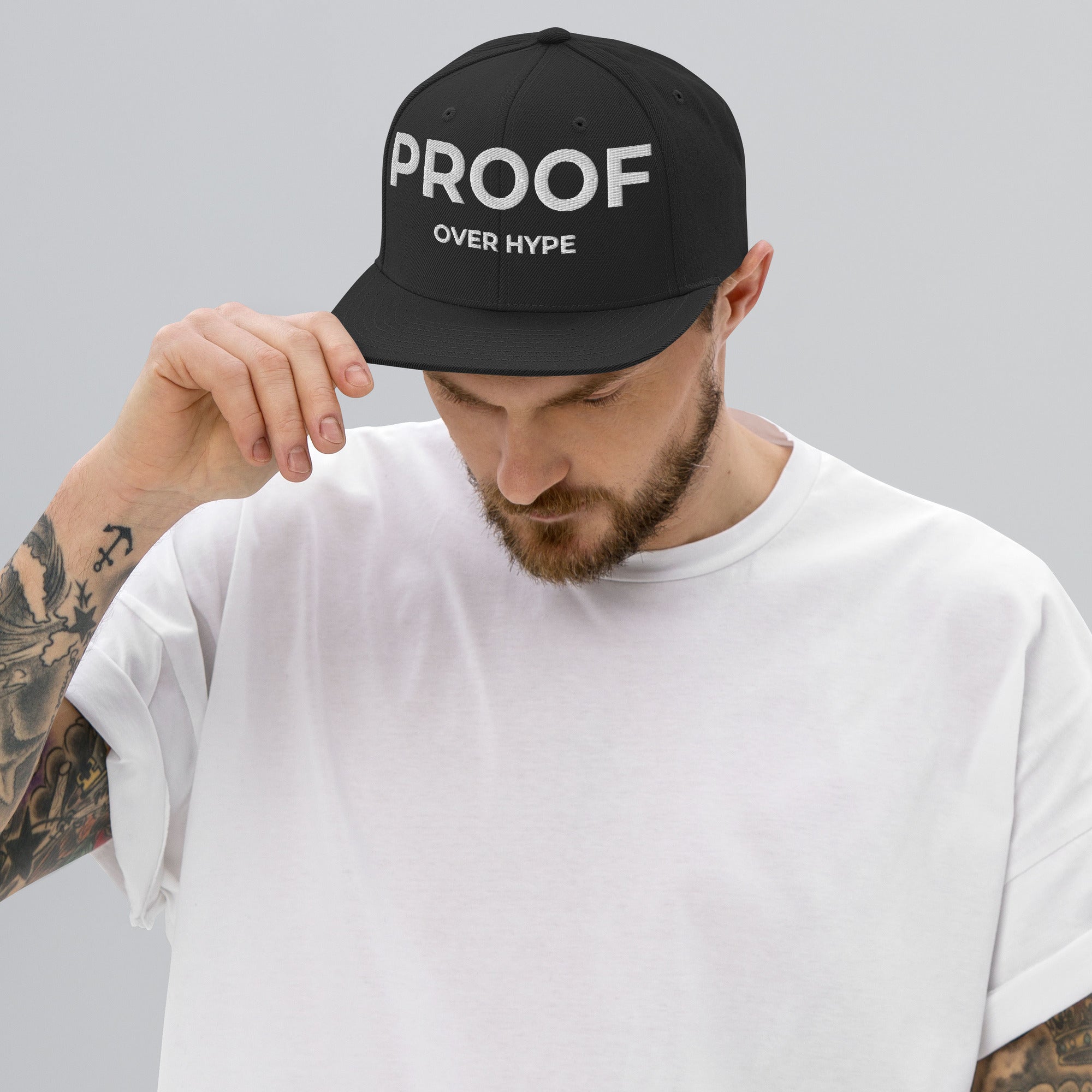 Proof Over Hype snapback hat by TheCapTribe – black with white embroidery